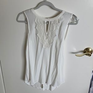 Cream sleeveless blouse with crochet detailing